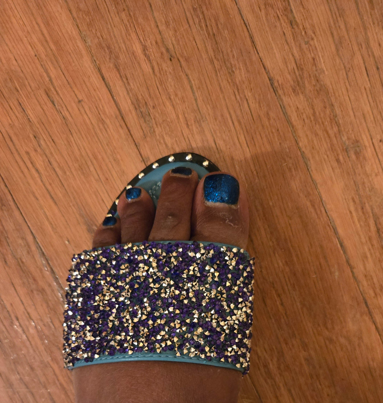 Blue Pretty Diamond Slippers worn, featuring purple and gold rhinestones with open-toe design, stylish for casual or clubbing outfits.