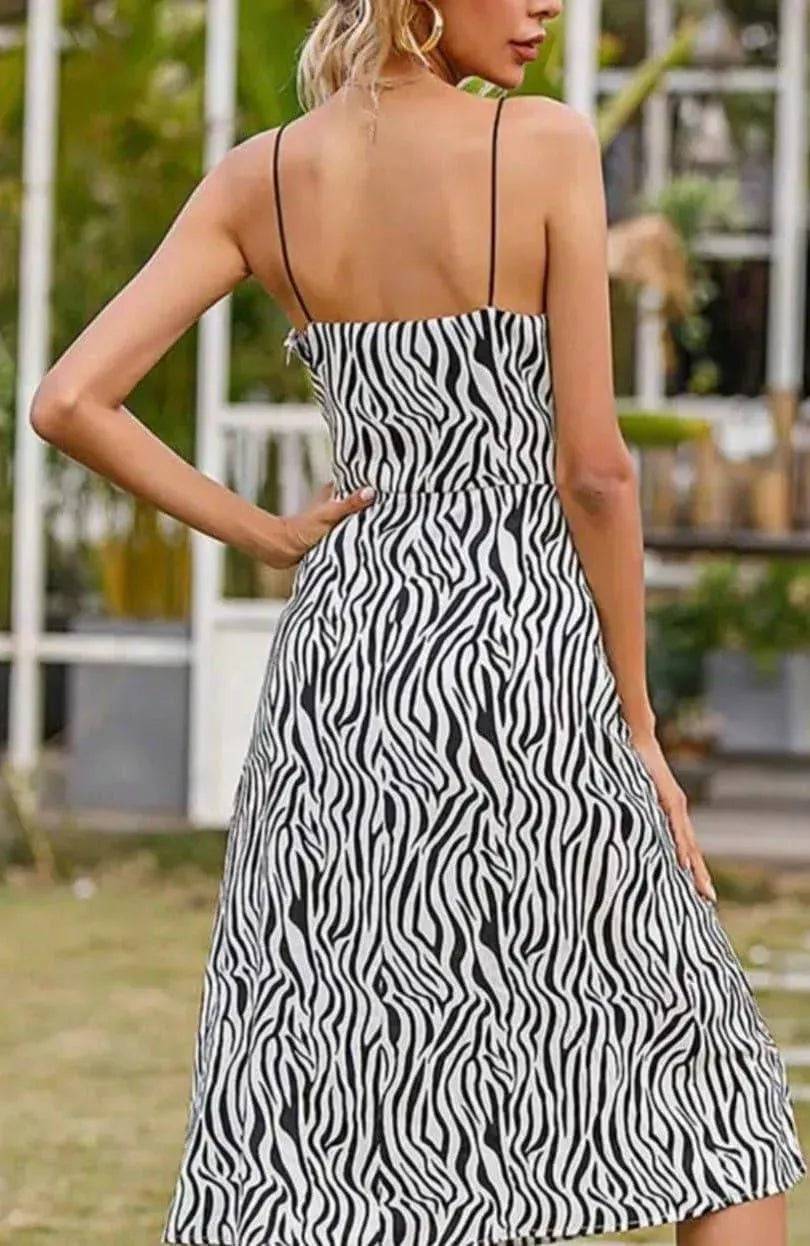 Zebra print Anna midi dress from My Sexy Black Boutique, featuring a stylish mid-length design and bold animal pattern.