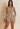 My Sexy Black Give It Up romper displayed on a model, featuring a stylish and trendy one-piece jumpsuit with a fitted silhouette.
