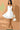 White Lena mini dress by My Sexy Black, stylish sleeveless mini dress with fitted silhouette, displayed on a hanger.