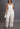Cream-colored sissy overalls jumpsuit for women from My Sexy Black Boutique, featuring a stylish and comfortable design.