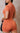 Orange romper from My Sexy Black called the Only Me Romper, featuring a stylish, fitted design perfect for casual or summer wear.