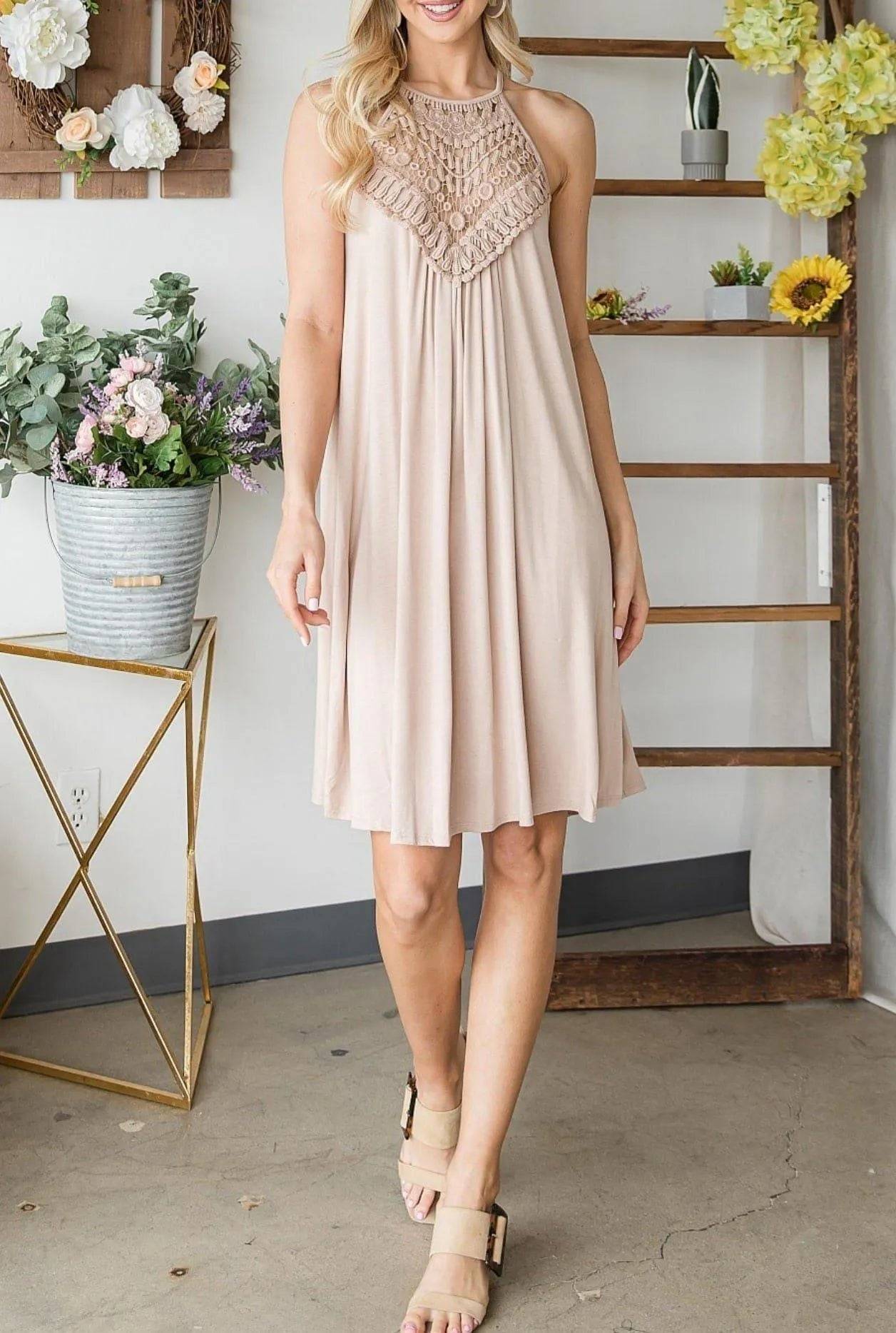 Cream Sally Crochet Mini Dress with lace halter neckline and knee-length A-line silhouette, ideal for casual and classy occasions.
