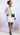 White Bobbi News Press Dress by My Sexy Black Boutique, front view showcasing tailored design and elegant fit.