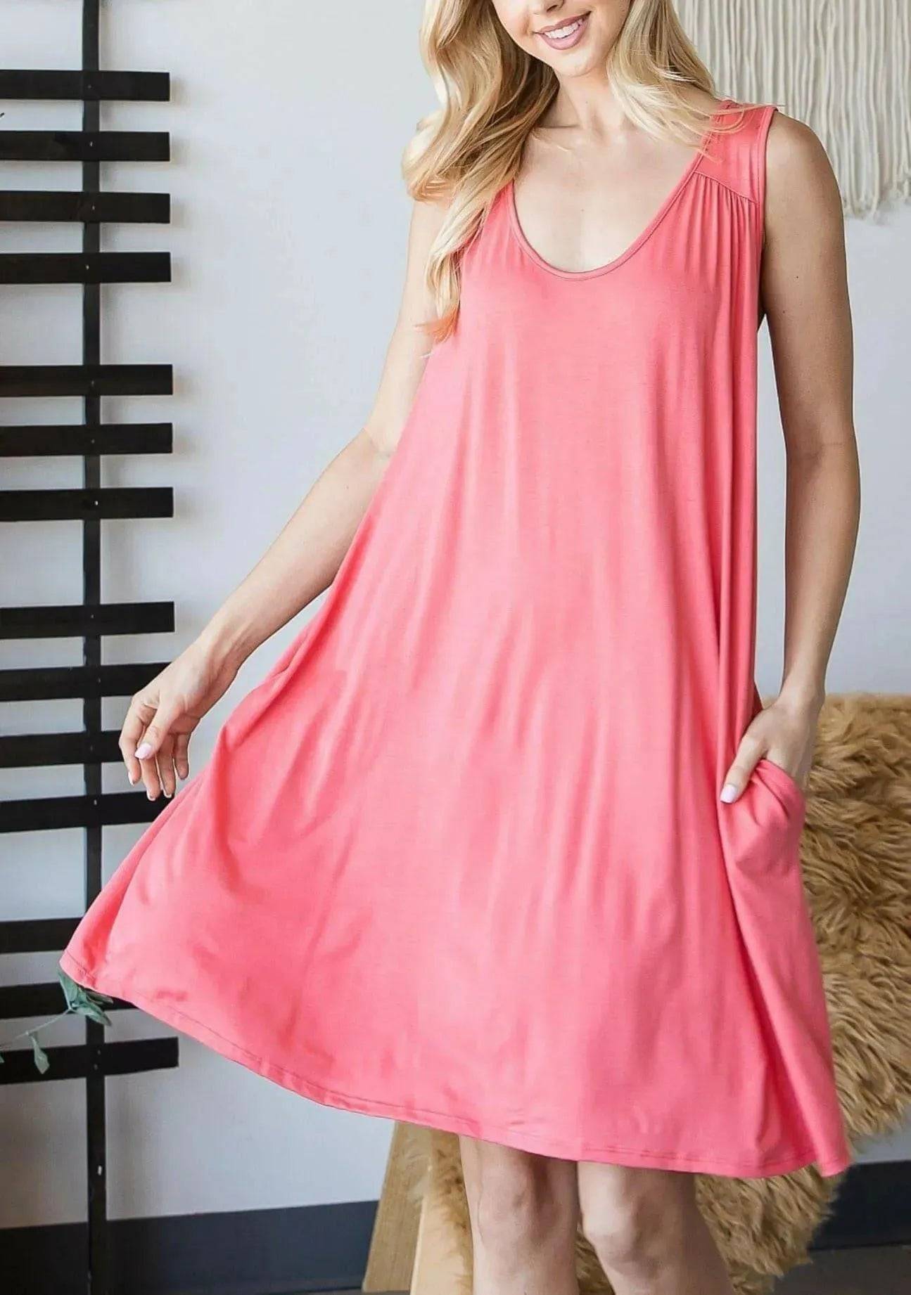 Sally Crochet Mini Dress in coral with scoop neckline and sleeveless design, knee-length with a loose, comfortable fit for everyday wear.