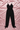 Black See Me Split jumpsuit by My Sexy Black Boutique featuring a stylish split design and fitted silhouette.