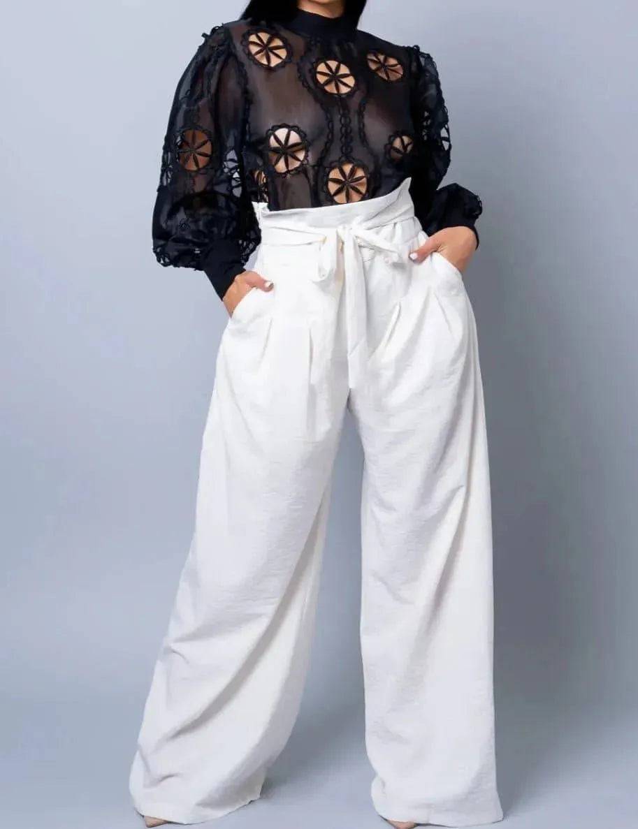 White Bow Down Pants by My Sexy Black Boutique, featuring a stylish bow detail and relaxed fit, shown on a model.