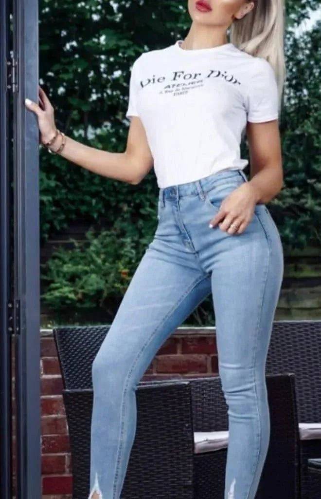 Light blue distressed split jeans from My Sexy Black Boutique, featuring ripped details and a casual fit.
