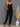 Black See Me Split bodysuit jumpsuit from My Sexy Black Boutique, featuring a fitted design with stylish split details.