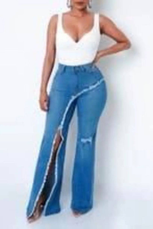 Medium wash blue slit jeans by My Sexy Black Boutique, showcasing stylish distressed details and slim fit design.