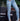 Light blue distressed split jeans from My Sexy Black Boutique showing a fitted design with ripped details and frayed hems.