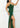 Hunter green draped wrap-style maxi evening dress from My Sexy Black Boutique, featuring a hi-low hem and elegant silhouette.