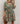 Green Peacock Mini Dress from My Sexy Black Boutique, fitted style with vibrant peacock feather pattern and sleeveless design.